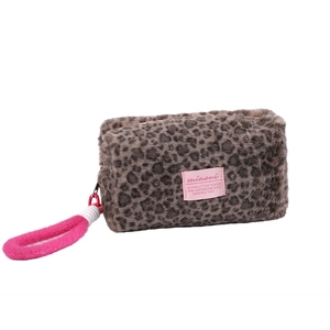 Plush leopard print makeup bag with pink carrying handle and decorative label