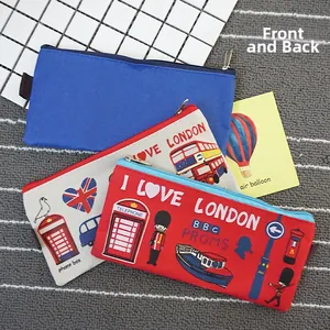 Detail view of London themed Oxford cloth pencil cases with zipper and iconic bus prints