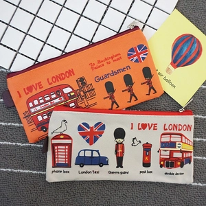 Detailed view of London themed canvas pencil cases featuring red buses and royal guards