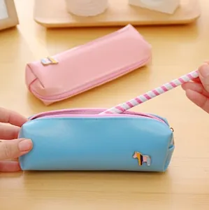 Minimalist PU leather pencil case with cute pony badge in blue and pink pastel colors