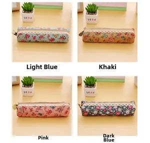 Detail view of four vintage floral canvas pencil cases with elegant lace and metal zippers