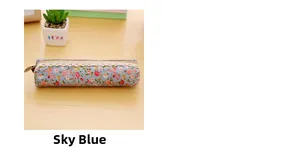 Detail of sky blue floral canvas pencil case with lace trim and vintage metal zipper