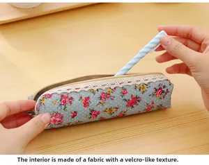 Detail of blue floral canvas pencil case with lace trim and brushed fabric interior