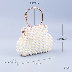 Detailed view of beaded evening clutch with gold ring handle and dimensions shown