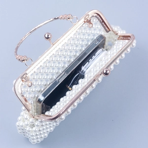 Detail of pearl woven evening bag showing interior capacity for a large smartphone