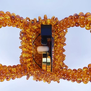 Overhead view of handmade amber beaded bag showing interior space with daily essentials