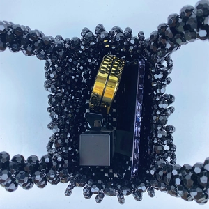 Detail view of handmade black beaded bag showing interior capacity with daily essentials