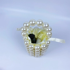 Top view of pearl bucket bag showing satin drawstring liner and interior capacity