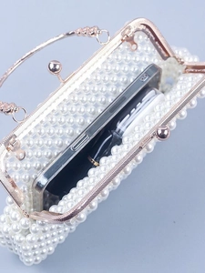 Elegant white pearl woven shell bag with rose gold frame and diamond handle for women