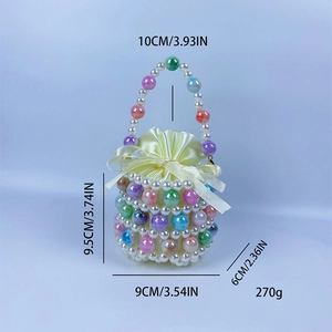 Detailed view of handmade beaded bucket bag with colorful pearls and yellow satin lining
