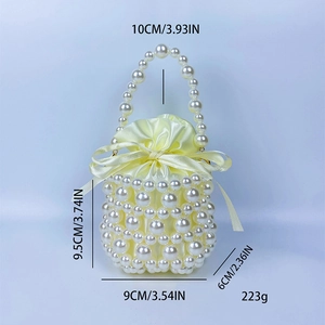 Handmade light yellow beaded pearl bucket bag with dimensions 9.5x9x6cm and satin liner