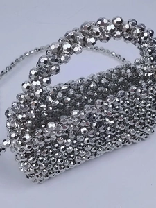 Sparkly silver beaded handbag with top handle and chain strap for evening parties