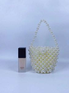 Handmade woven pearl bucket handbag for women with beaded handle and elegant white design
