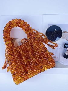 Handmade amber acrylic beaded tote bag with long tassels and vintage woven design