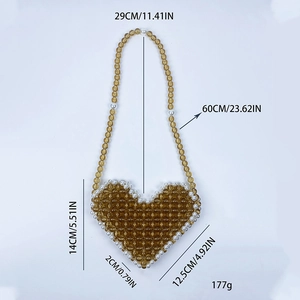 Detail view of heart-shaped beaded bag with amber beads and white pearls and size chart