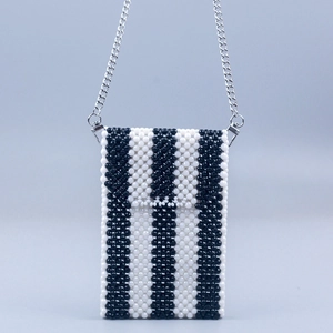 Handmade beaded crossbody phone bag with black and white vertical stripes and silver chain