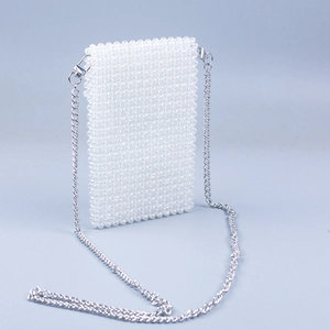 White faux pearl woven crossbody phone bag with a detachable silver chain strap