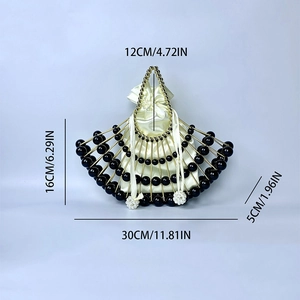 Detail of fan-shaped pearl evening bag with gold metal frame and dimensions info