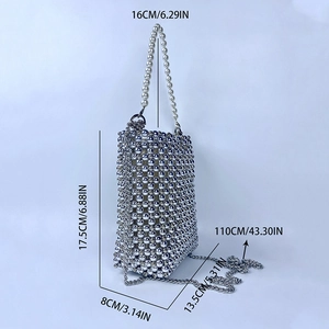 Close-up of silver metal bead handbag with pearl handle and 110cm chain strap detail