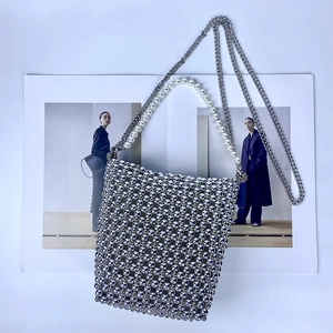 Detail of silver beaded mini handbag with premium pearl handle and detachable chain strap