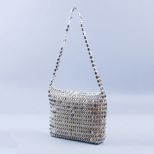 Detail of silver chainmail shoulder bag with interlocking metallic round sequins