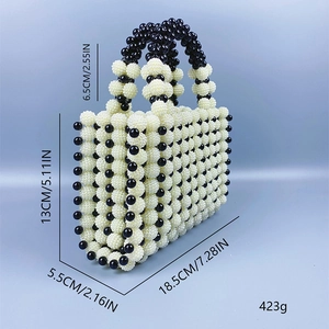 Detail view of a handmade beaded handbag featuring dimensions and 423g weight specs
