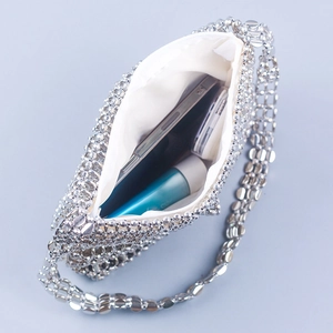 Detail of silver beaded shoulder bag showing inner lining and daily storage capacity