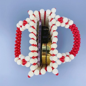 Top view of handmade beaded purse showing interior space for a smartphone and compact