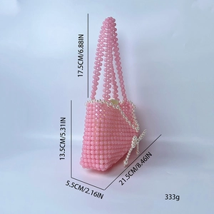 Pink handmade beaded handbag with pearl bow charm and detailed product dimensions