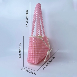 Pink handmade beaded handbag dimensions showing 21.5cm width and 13.5cm height
