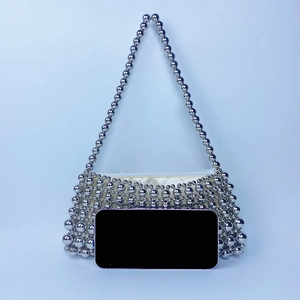 Compact silver beaded handbag featuring vintage woven pearls and interior satin lining