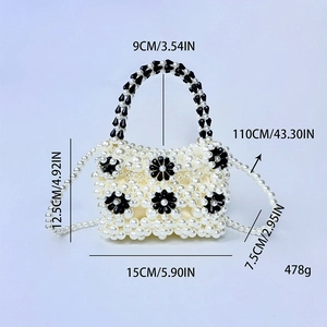 Macro detail of handmade beaded bag with white pearls and flower patterns including measurements