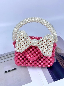 Handgemaakte roze kralen handtas met witte parelmoeren strik en bovenste handvat