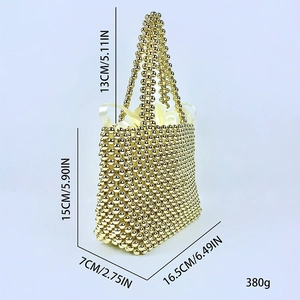 Detail view of gold beaded handbag with drawstring liner and specific size measurements