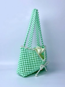 Handmade mint green beaded handbag with pearl bow and satin lining for elegant women
