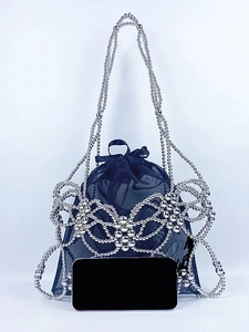 Silver woven metal bead shoulder bag with hollow butterfly pattern and mesh pouch