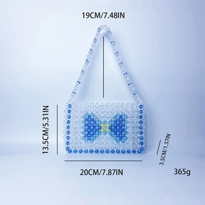 Detailed dimensions of blue beaded bow handbag: 20x13.5x3.5 cm with 19cm handle drop