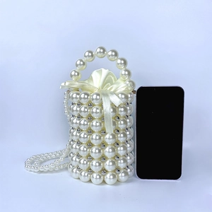 Close-up of handmade pearl woven mini bucket bag with satin drawstring lining and beads