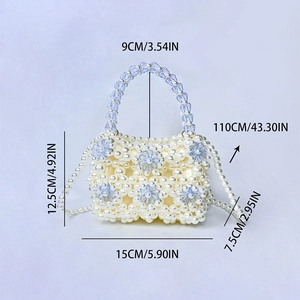 Detail of beaded mini bag showing blue crystal flowers and white pearl weaving