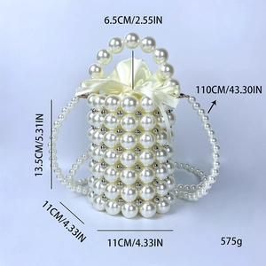 Detail view of handmade pearl mini bucket bag with satin lining and dimensions