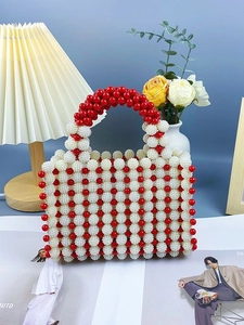 Handmade red and white beaded top handle bag with modern pearl texture and rectangular design