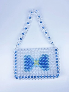 Handmade beaded rectangular handbag with blue bow design and yellow crystal bead accents