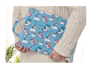 Detail of blue unicorn canvas document bag with Dream Like a Unicorn print and handle