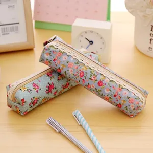 Floral canvas pencil case with lace trim in vintage forest style on wooden desk