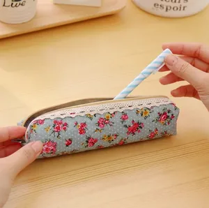 Floral canvas pencil case with lace trim and pink flower pattern on light blue fabric