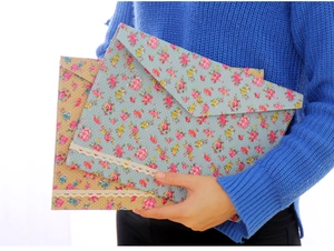 Floral A4 document folders with lace trim and metal snap closure held by person