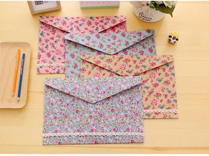 Floral A4 file folders set in four colors with delicate lace and metal snap closure
