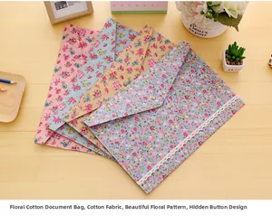 Detailed view of floral cotton A4 file bags with metal snaps and lace trim