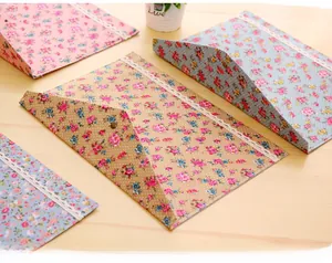 Detailed view of floral A4 file envelopes featuring lace trim and metal snap buttons