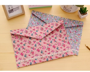 Detail of A4 floral fabric document bags with lace trim and metal snap button closure
